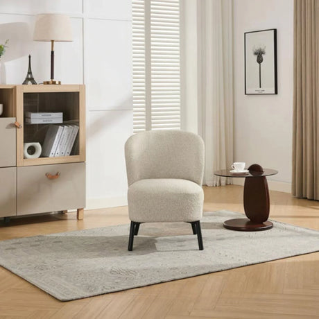 Natural beige accent chair with curved backrest on grey rug in modern living room