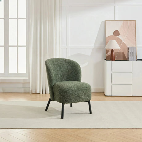 Forest green accent chair with curved back and black legs on beige rug in modern living room
