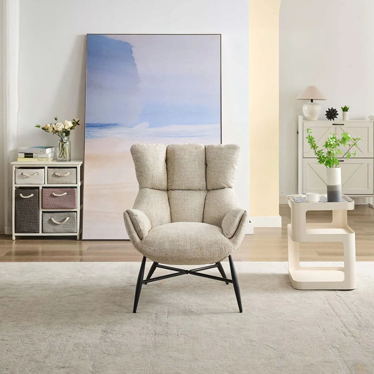 Beige accent chair with padded backrest and black legs in modern living room setting