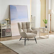Beige accent chair with plush upholstery and black legs in a modern living room setting