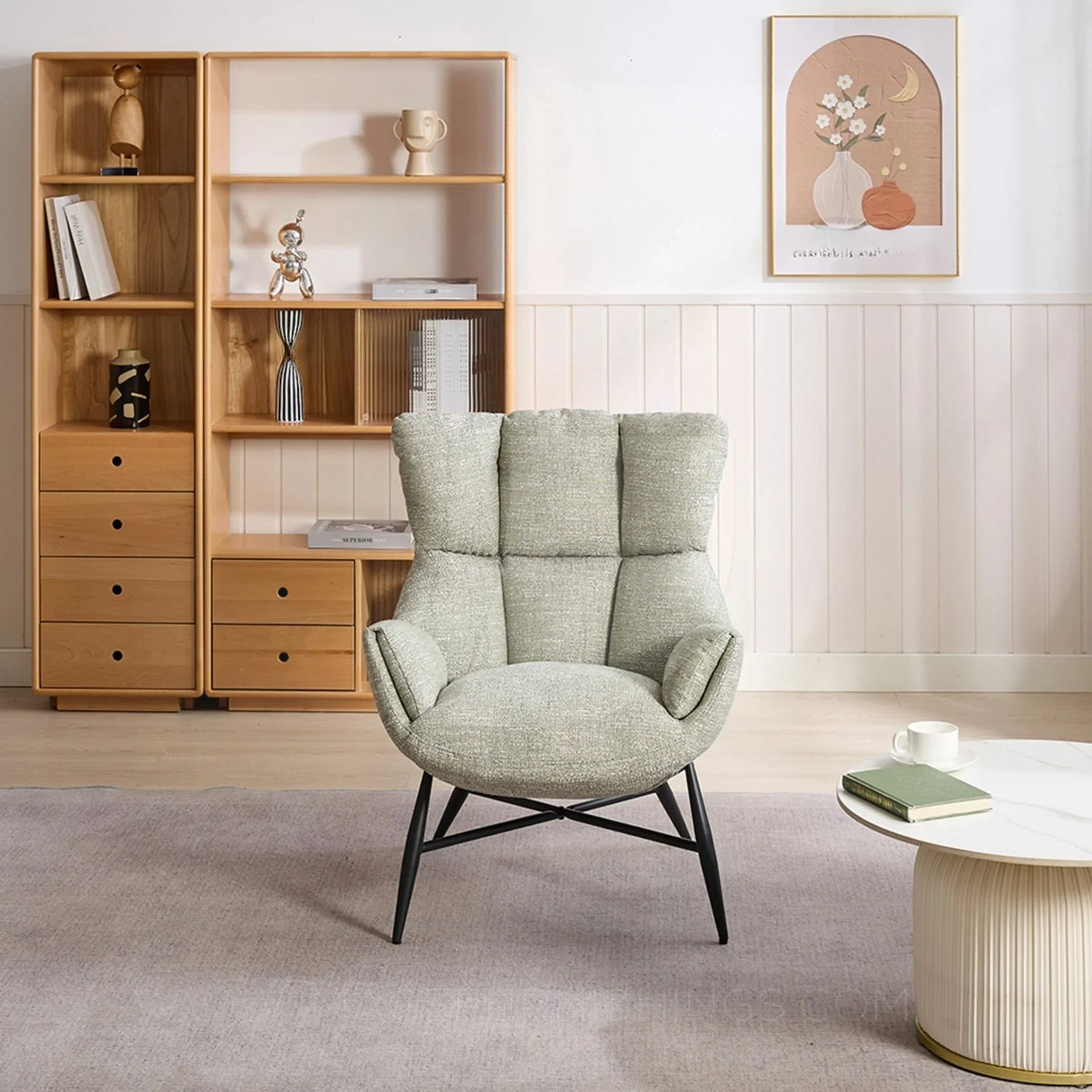 Green accent chair with padded upholstery and black legs in modern living room setting