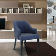 Grey fabric accent chair with curved arms on rug in modern living room setting