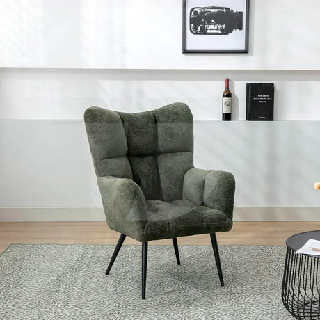 Green accent chair with black metal legs, textured upholstery, set on patterned rug in lounge