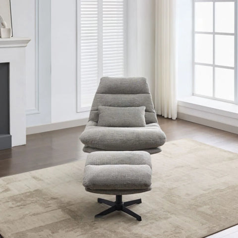 Grey leisure chair with matching footstool on beige rug in modern living room