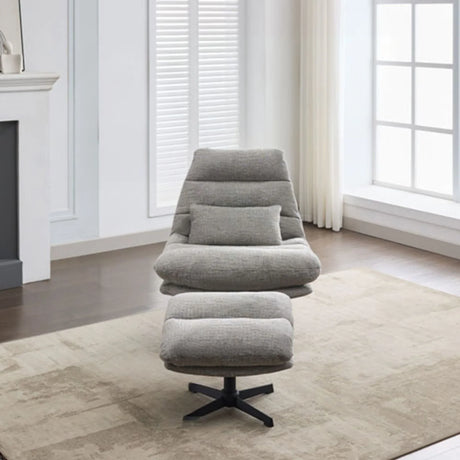 Grey leisure chair with matching footstool on beige rug in modern living room