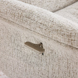 Beige swivel chair side lever detail on textured fabric armrest
