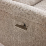 Close up of oatmeal fabric swivel chair with metal recliner lever