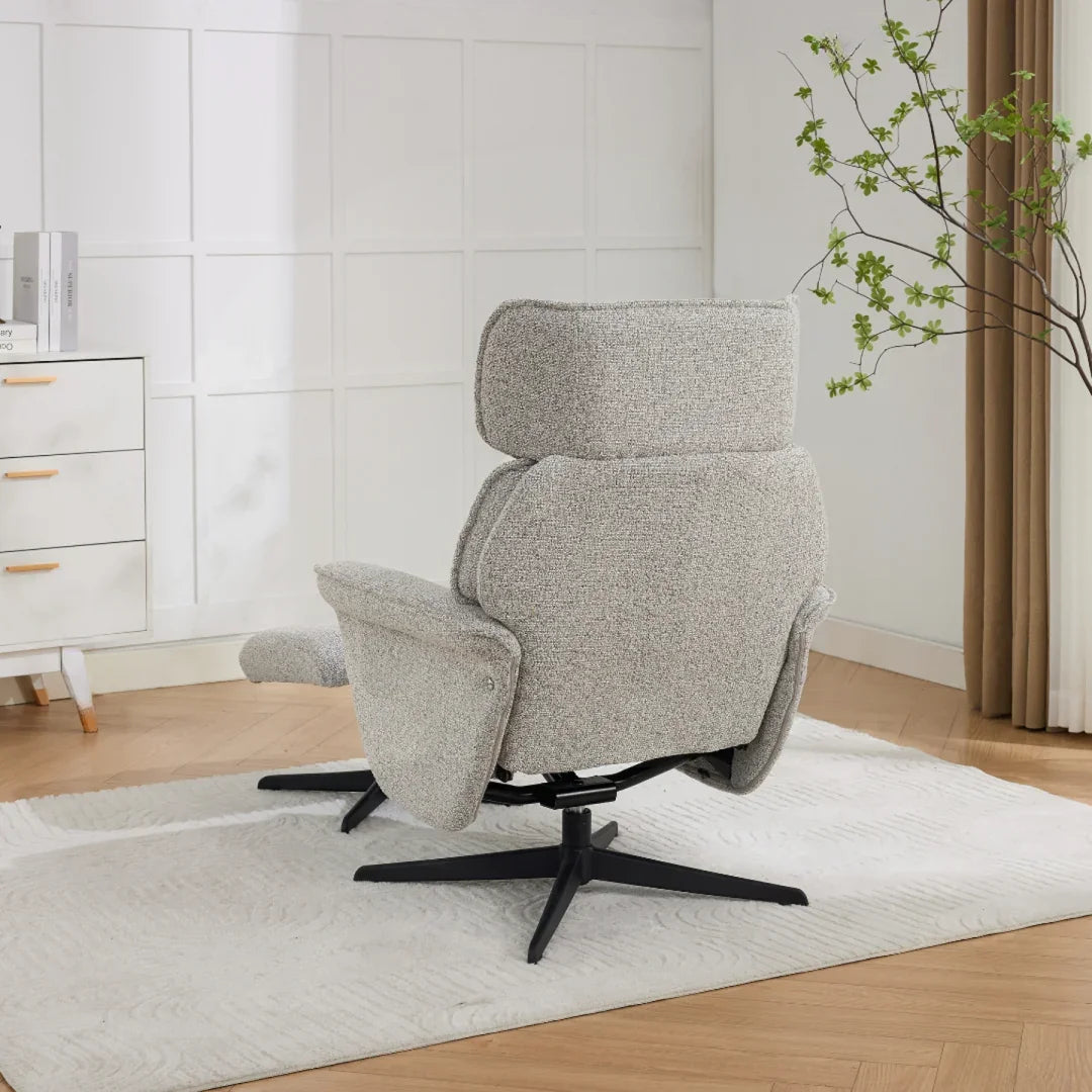 Pearl grey swivel leisure chair with footstool and black base on light rug