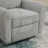 Close-up of grey fabric swivel chair with rounded arms on patterned rug