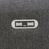 Close-up of USB charging ports set in dark grey fabric upholstery