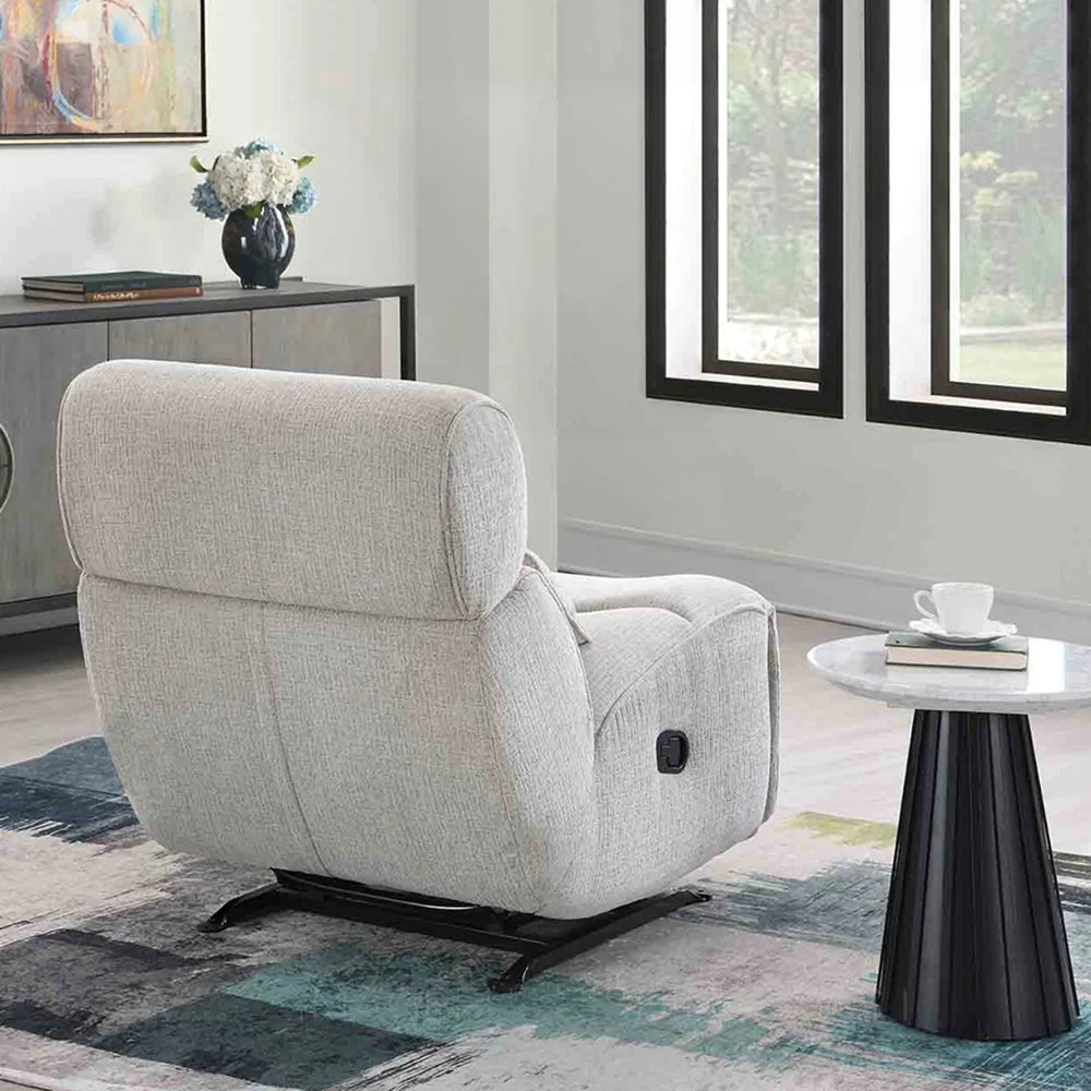 Linen manual recliner rocker chair in a modern living room with side table and rug