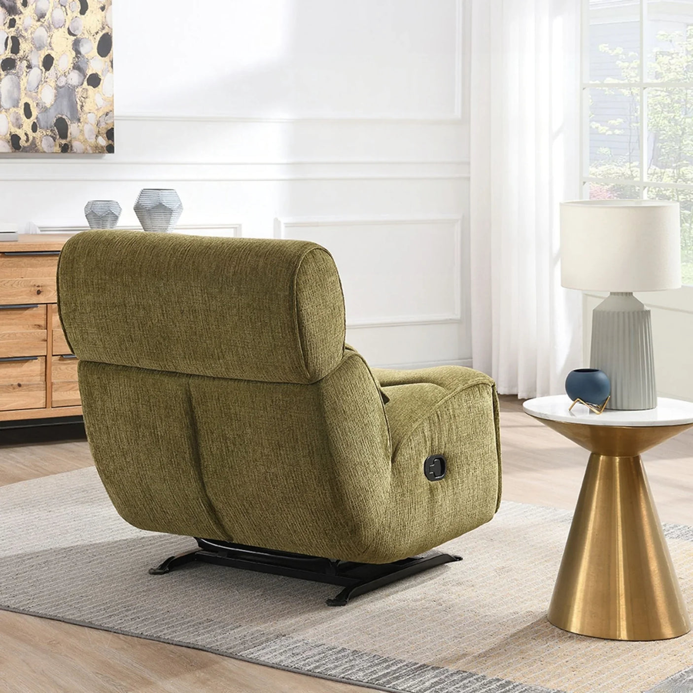 Olive manual recliner rocker chair viewed from the back in a modern living room setting
