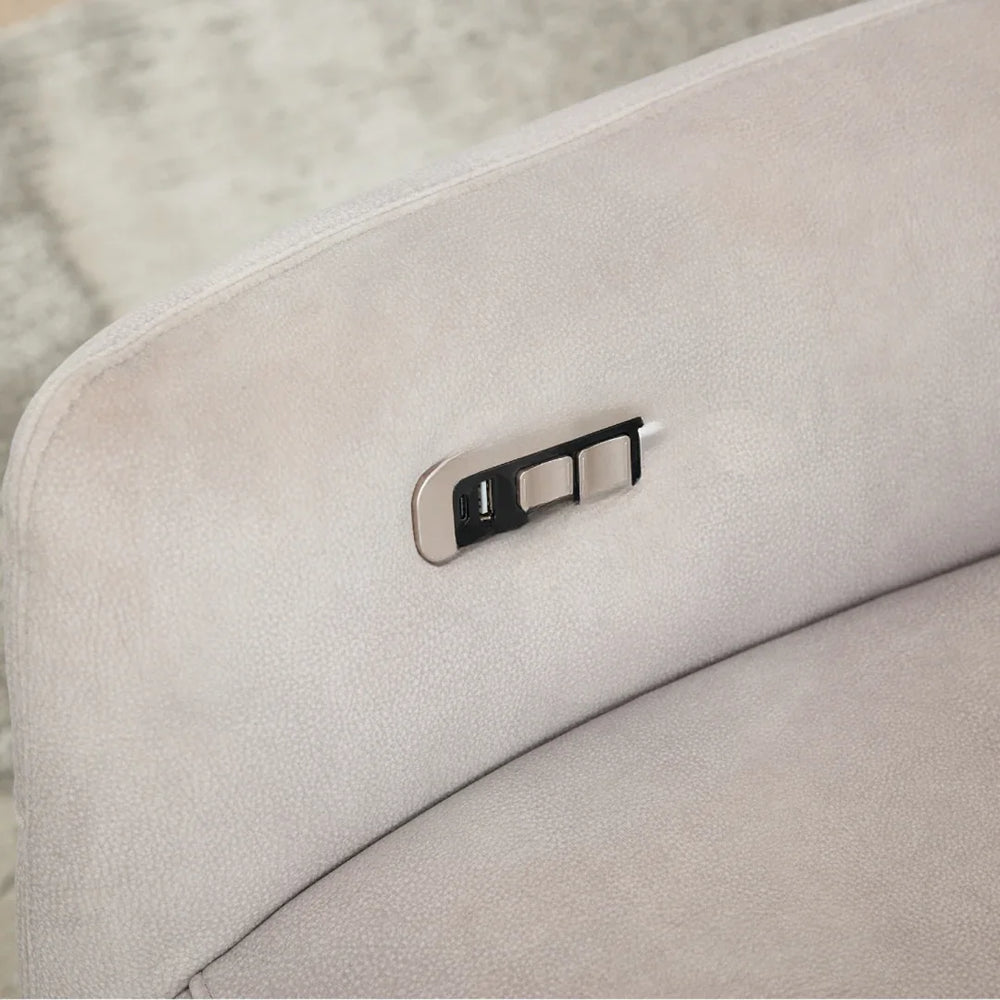 Close up of oyster swivel chair showing USB port and control buttons on fabric armrest