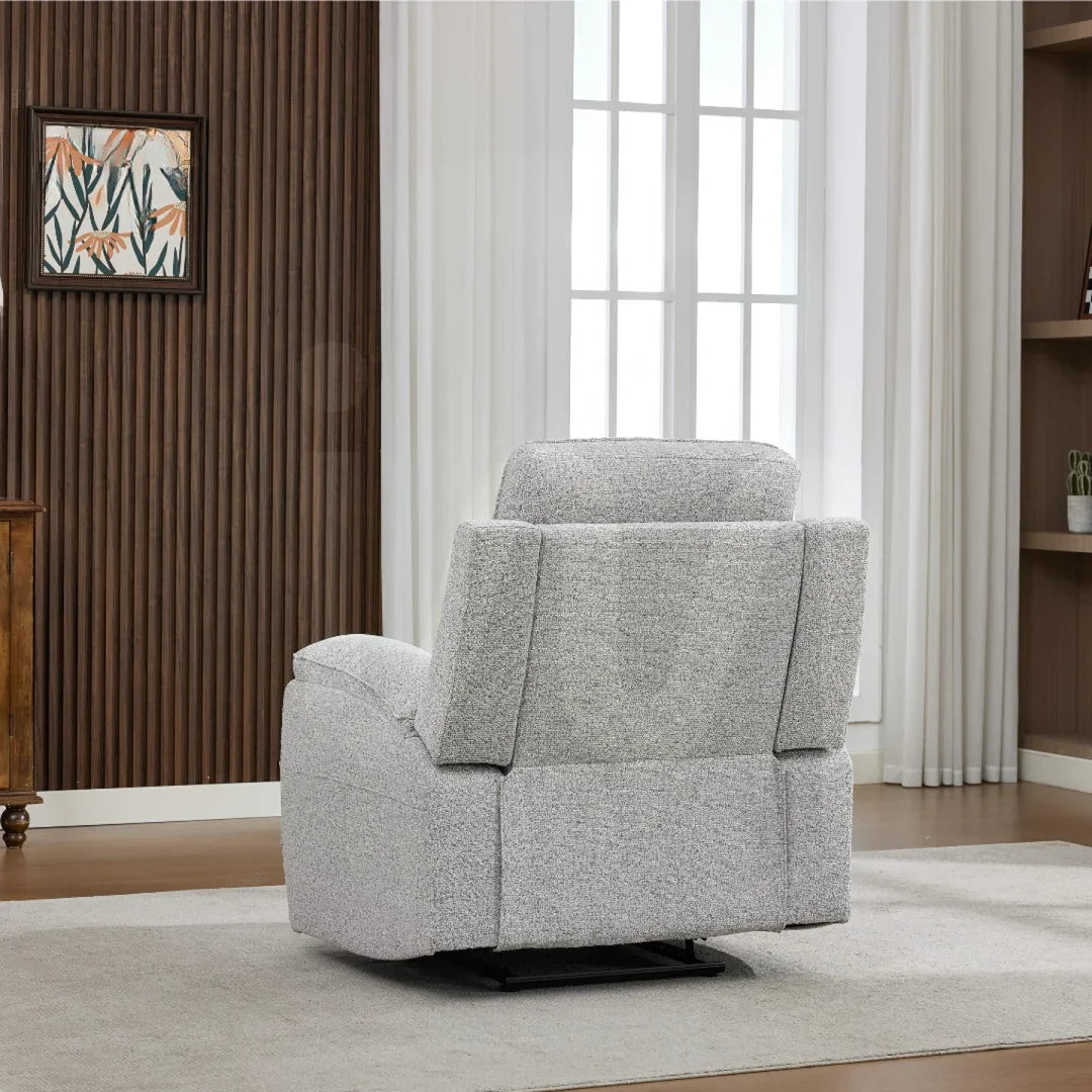 Light grey fabric armchair rear view on beige rug in modern living room