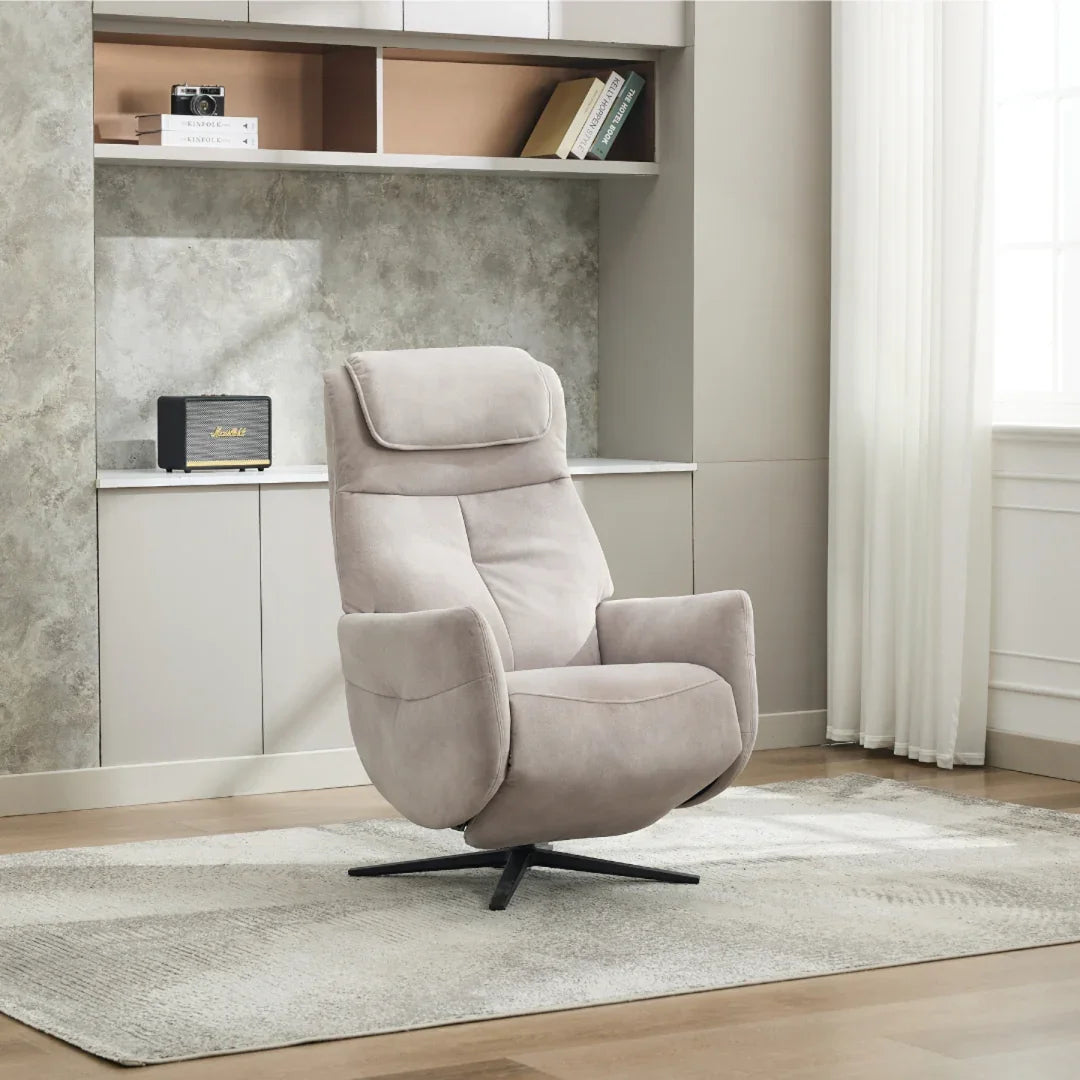 Oyster swivel chair with padded seat and headrest on a patterned rug in modern living room