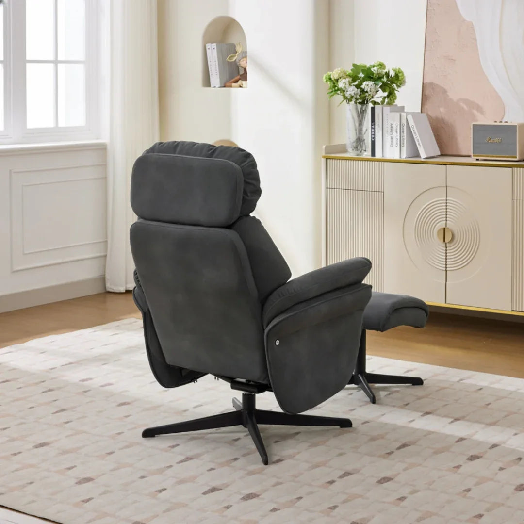 Dark grey swivel leisure chair with matching footstool and black base in modern living room