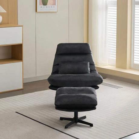 Dark grey leisure chair with matching footstool on rug in modern living room setting