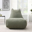 Pearl lounger bean bag in moss green fabric placed in a bright modern living room