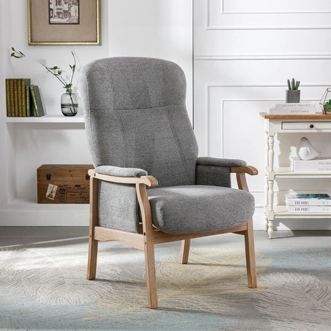 Grey armchair with wooden frame on patterned rug in modern living room setting