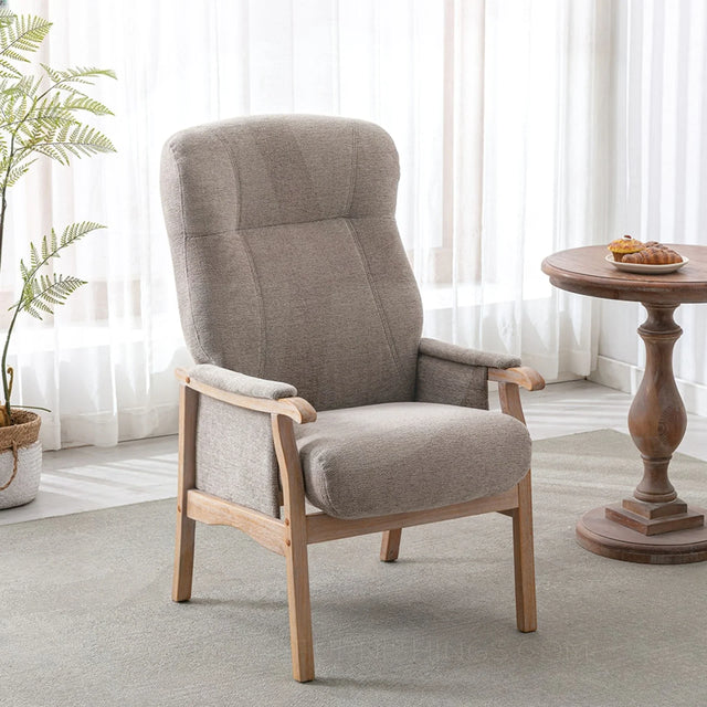 Oatmeal upholstered armchair with wooden frame in bright living room setting