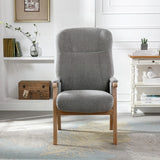 Grey fabric armchair with wooden legs in a modern living room setting