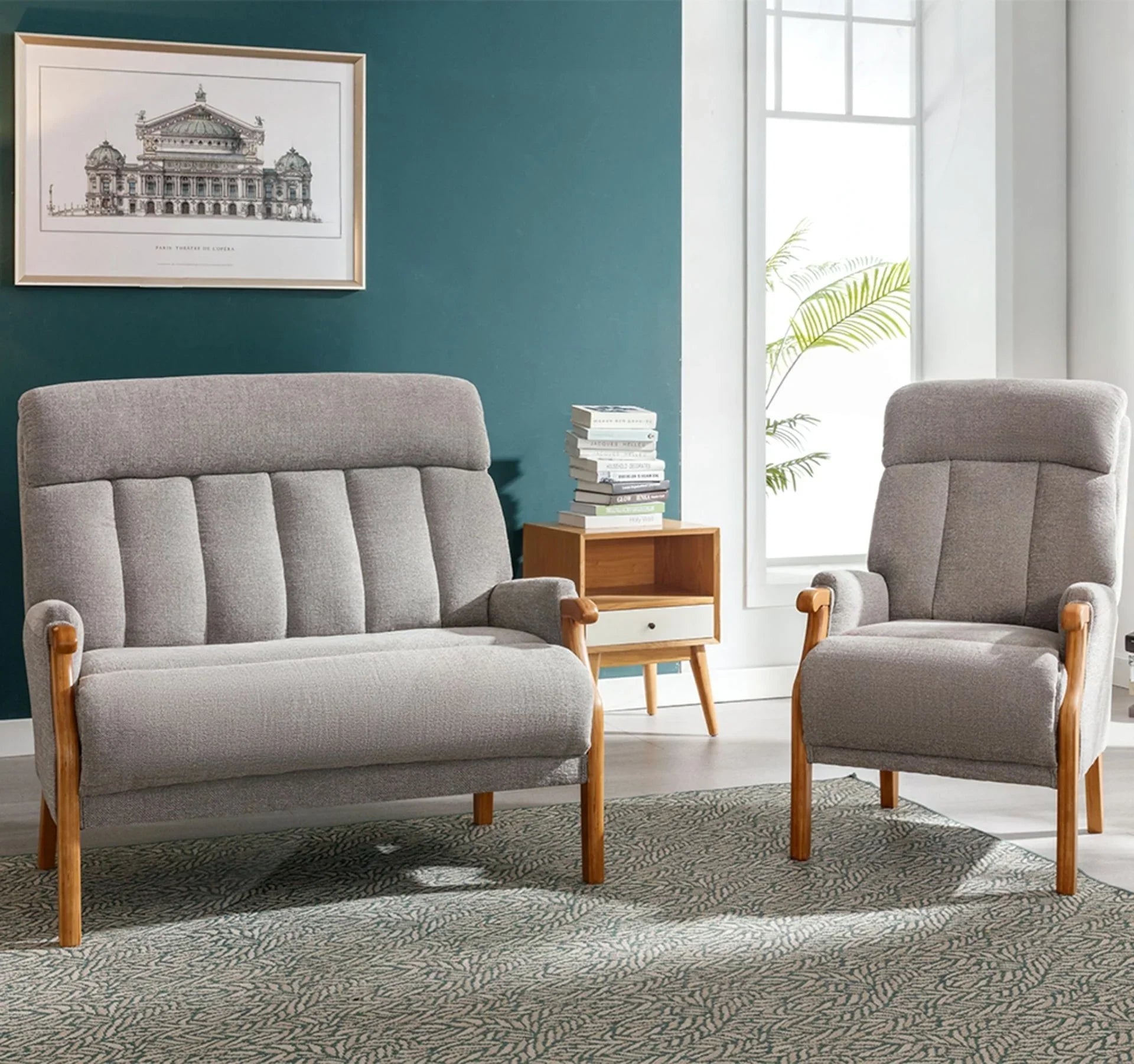 Blaze fireside chair in silver fabric with wooden legs beside matching sofa in modern living room