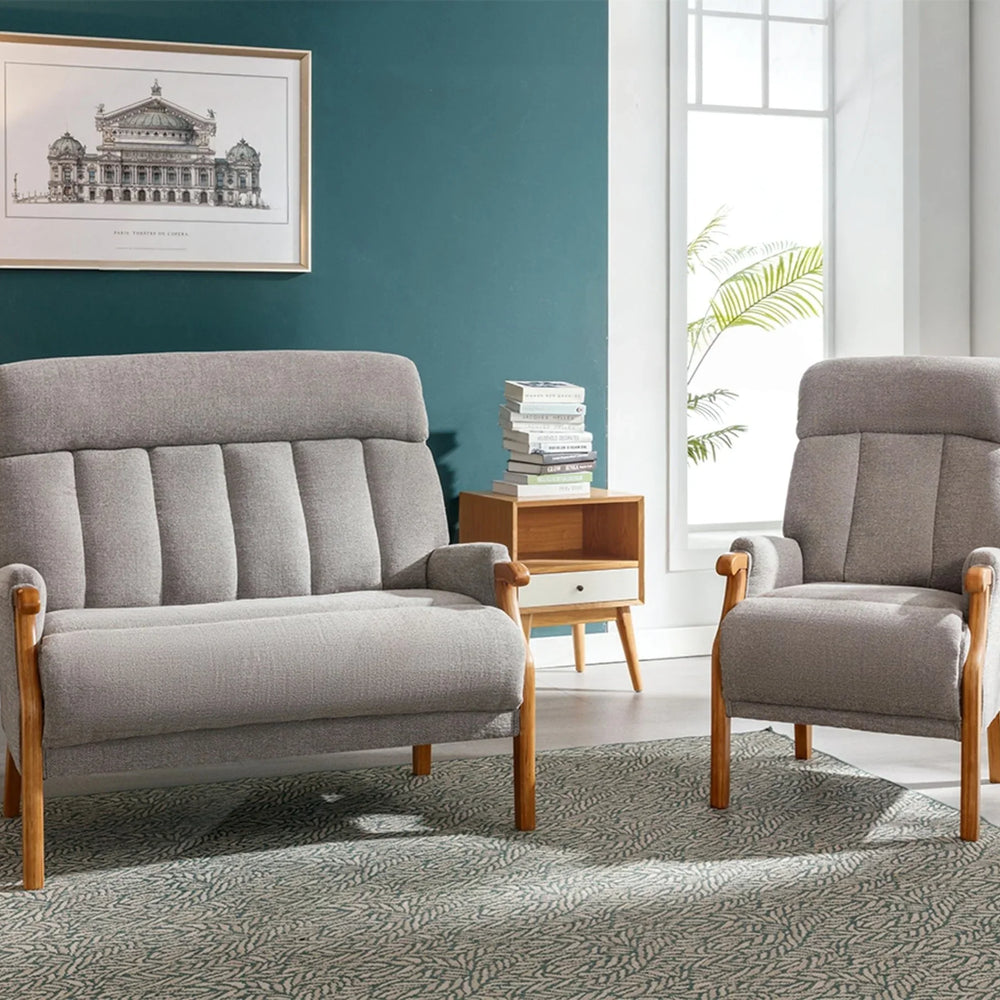 Silver fireside loveseat with wood arms and matching armchair in modern living room setting