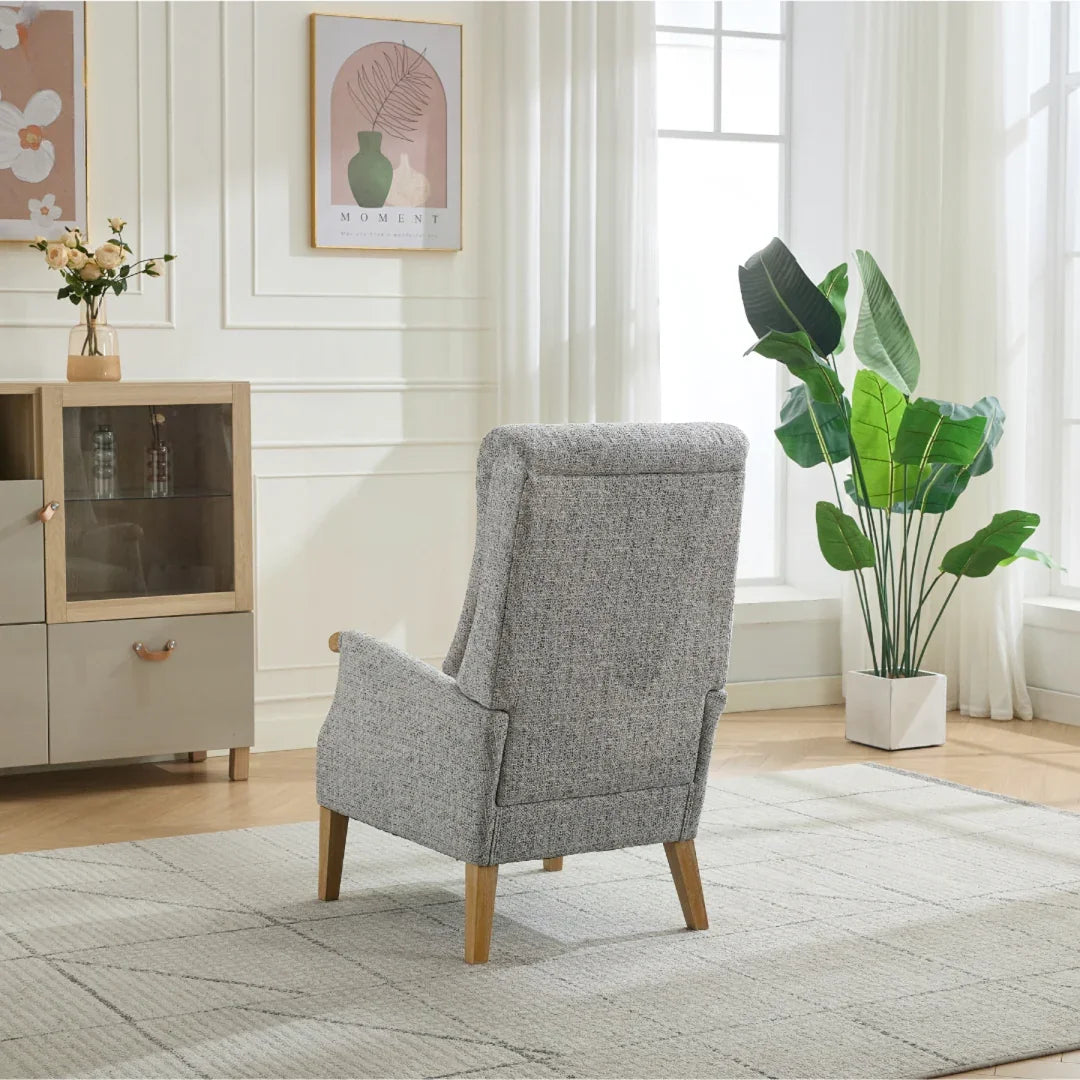 Thistle chair stone fabric with wooden legs in modern living room setting