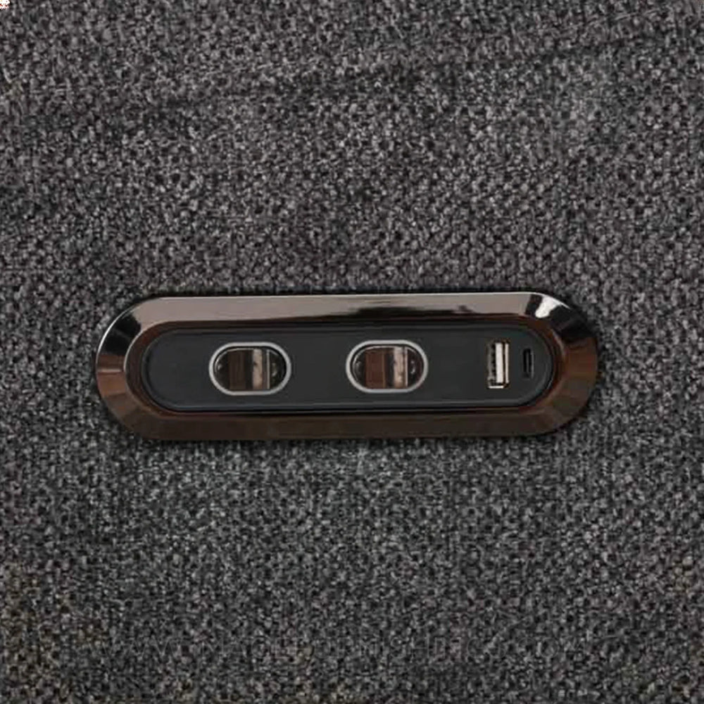 Close-up of power and USB control panel on dark grey swivel glide chair fabric