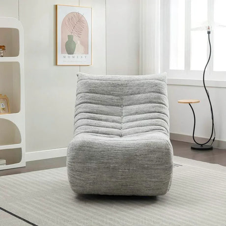 Grey reclining chair with soft fabric upholstery in modern living room setting
