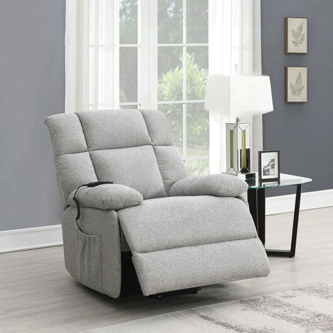 Light grey lift and rise massage chair reclined in modern living room setting