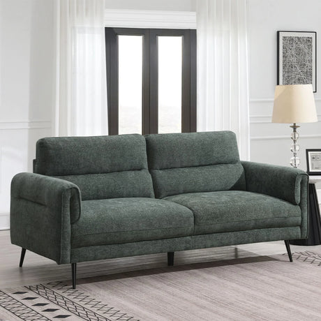 Winter moss 2.5 seater sofa with padded armrests and black legs in bright living room