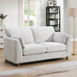 Light beige 2 seater loveseat sofa with cushions in a modern living room setting