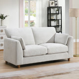 Light beige 2 seater loveseat sofa with cushions in a modern living room setting