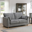 Modern grey fabric 2 seater loveseat with cushions in a bright living room
