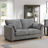 Modern grey fabric 2 seater loveseat with cushions in a bright living room