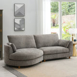 Grey fabric chaise sectional sofa with wooden legs in modern living room near large window
