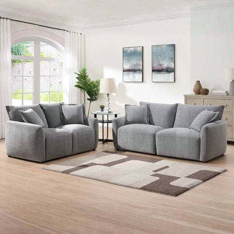 Light grey 2-seater loveseat sofa with cushions in modern living room setting