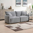 Light grey modular 2.5 seater sofa with cushions in modern living room setting
