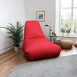 Quilted red bean bag chair in modern living room with wooden floor and plants
