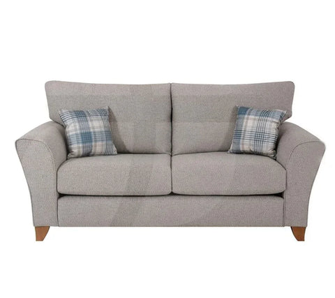Silver fabric sofa with angled arms and two plaid scatter cushions, front view