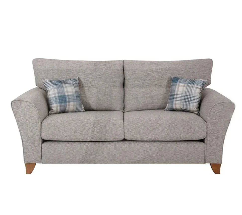 Silver fabric sofa with angled arms and two plaid scatter cushions, front view