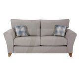 Silver fabric sofa with angled arms and two plaid scatter cushions, front view