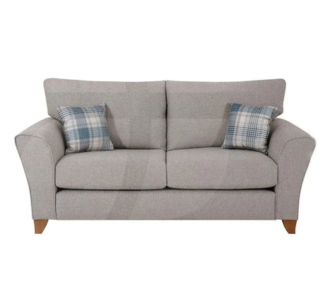 Silver fabric sofa with angled arms and two plaid scatter cushions, front view