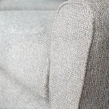 Close up of silver fabric sofa armrest with textured upholstery