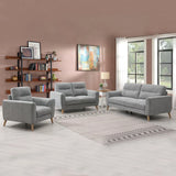 Grey fabric sofa set with armchair, loveseat, and three-seater in a modern living room