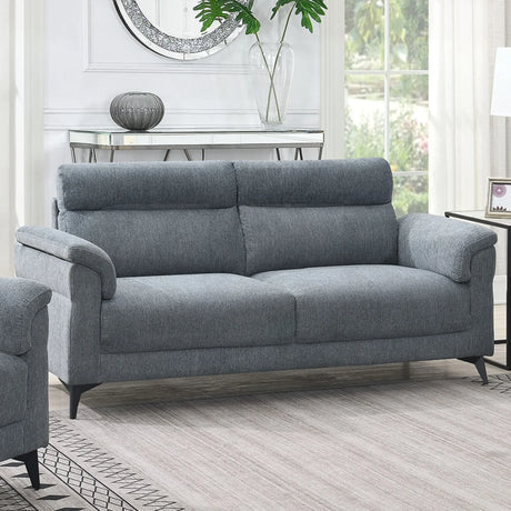 Grey fabric sofa with padded arms and metal legs in bright living room