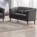 Graphite two seater loveseat sofa with vertical channel tufting and wooden legs in living room