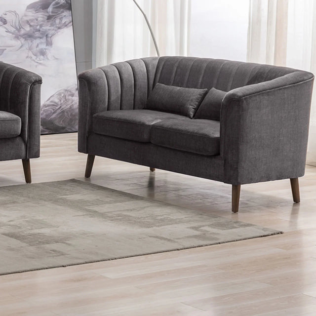 Graphite two seater loveseat sofa with vertical channel tufting and wooden legs in living room