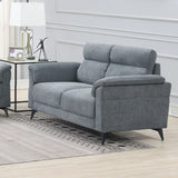 Grey fabric sofa with padded backrest and armrests in a modern living room setting